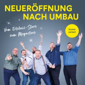 Das Pfundskerl-Team freut sich auf die Neueröffnung – sechs Männer mit Format in Feierlaune vor dem Eröffnungsmotiv