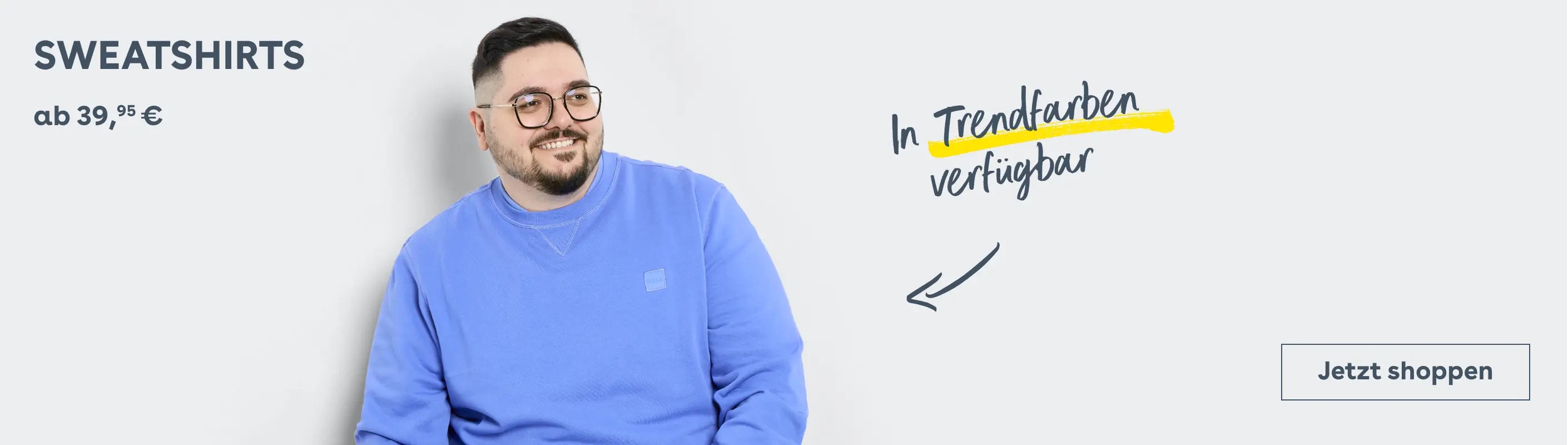 Mann im blauen Sweatshirt lächelt – Text: „In Trendfarben verfügbar, ab 39,95 €“