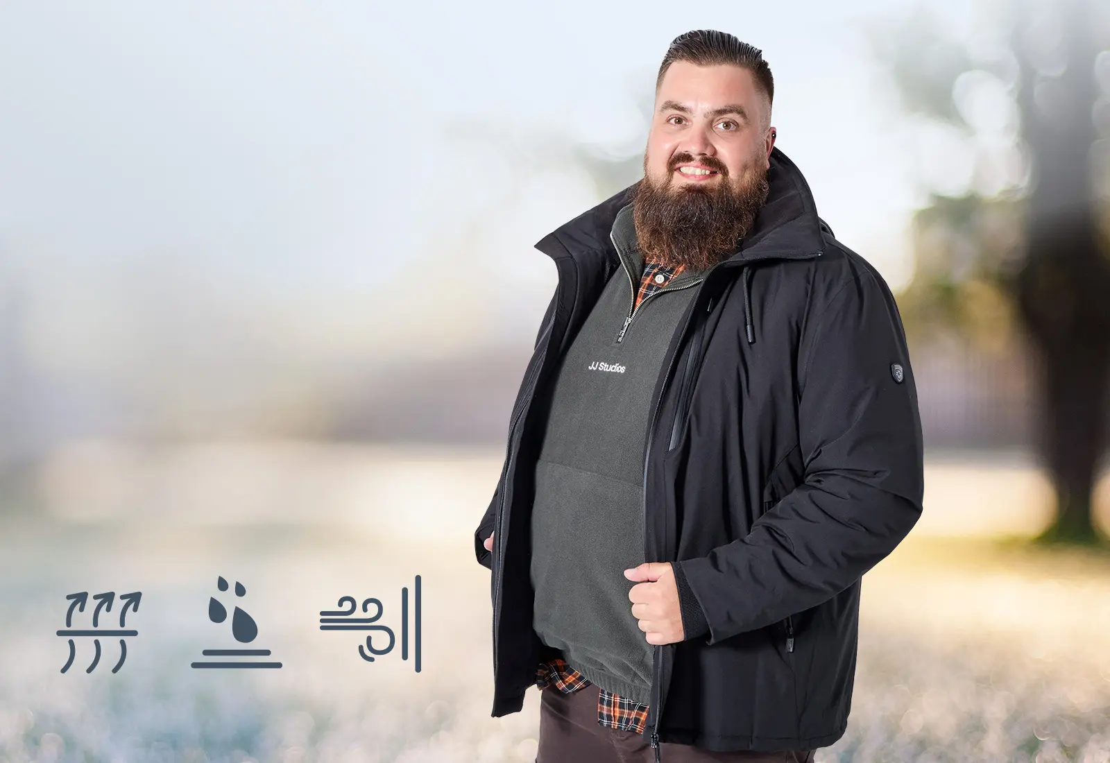 Mann mit schwarzer Outdoorjacke und wetterfestem Look für große Größen