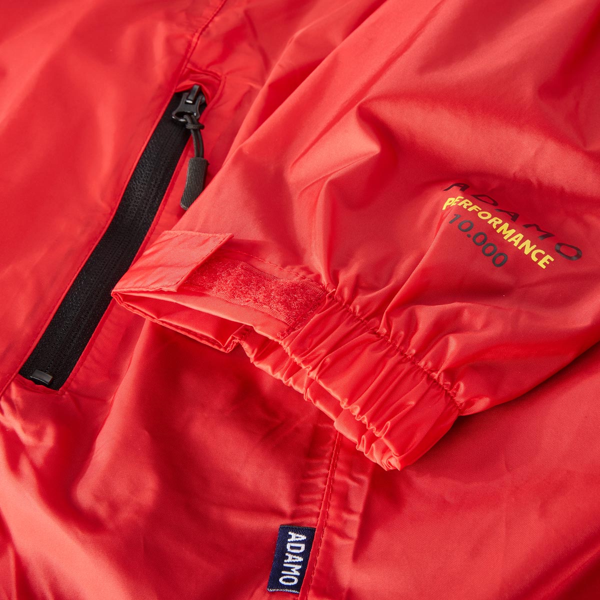 ADAMO Packbare Regenjacke mit Mesh-Innenfutter, wasserdicht rot