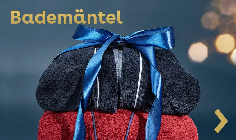 Stapel weicher Bademäntel mit Schleife als Weihnachtsgeschenk – kuschelige Wohlfühlideen für starke Männer